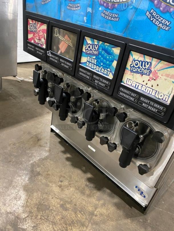 FBD Stainless Steel 4-Flavor Icee/Slushy Dispenser, Jolly Rancher style, countertop model. Electric-powered, good condition. SN: 12020200.