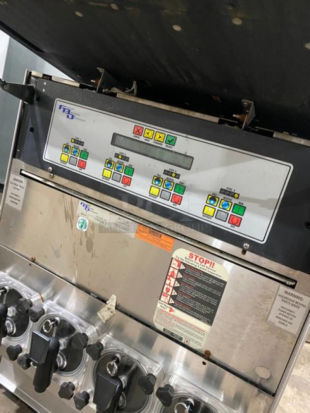FBD stainless steel 4-flavor icee/slushy dispenser, electric-powered, commercial-grade, serial number 12020200, control panel visible.