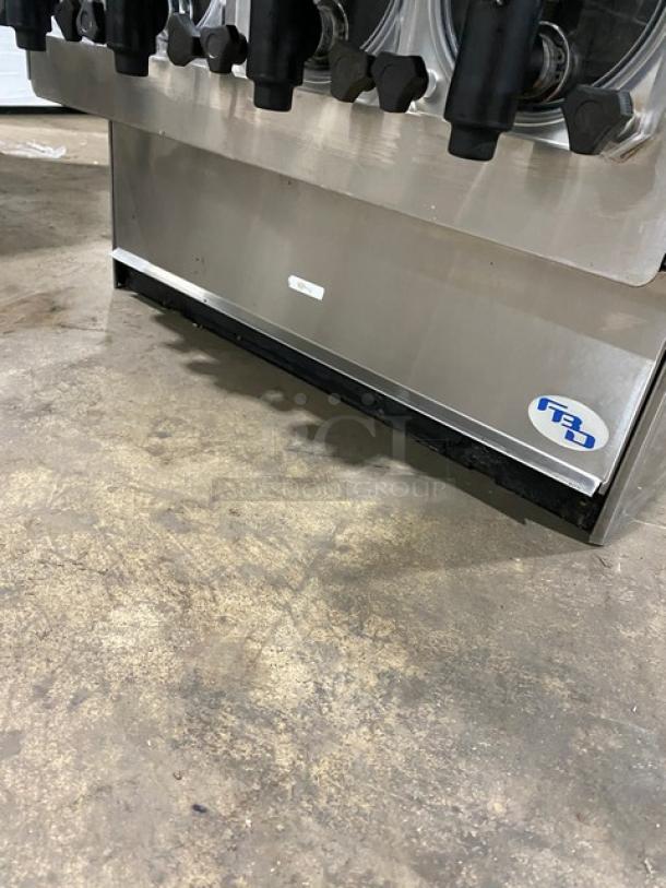 FBD stainless steel 4-flavor Icee/slushy dispenser, electric-powered, Jolly Rancher style, serial number 12020200, lightly used.