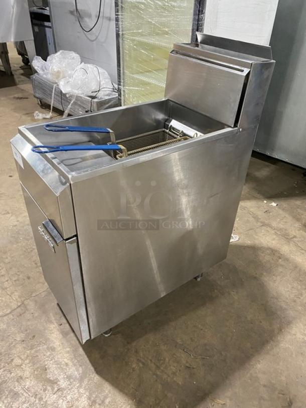 Asber commercial stainless steel gas deep fat fryer with back splash, basket hanger, fry basket, and legs. Excellent condition.