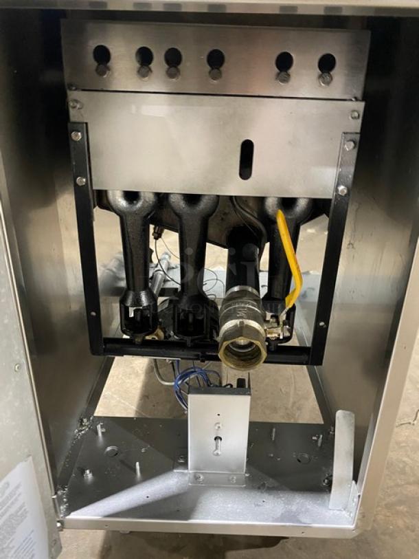 Asber commercial stainless steel gas-powered deep fat fryer with back splash, basket hanger, fry basket, and legs.