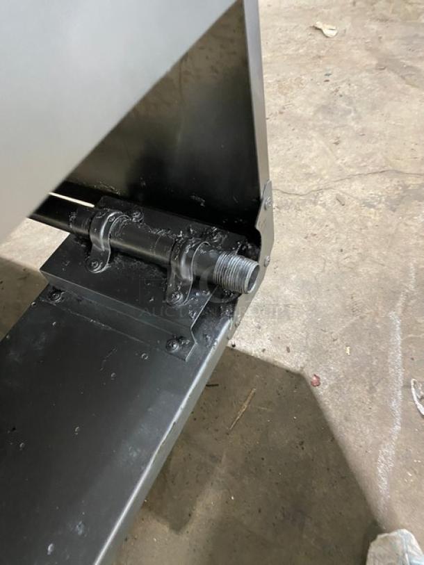 Asber stainless steel gas-powered deep fat fryer, featuring a back splash and basket hanger, with legs. Fry basket included.