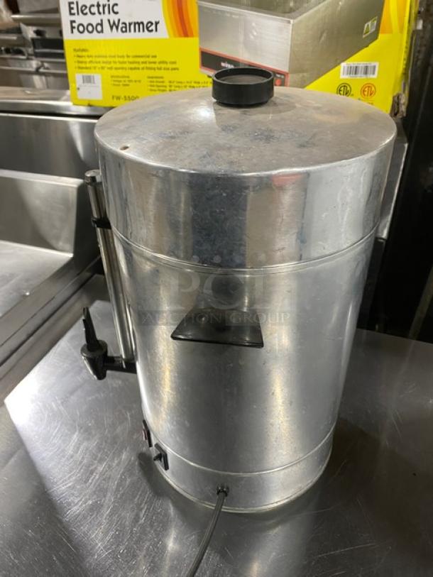 Commercial stainless steel electric coffee urn, insulated, used condition. Features spigot, power cord. Ideal for catering.