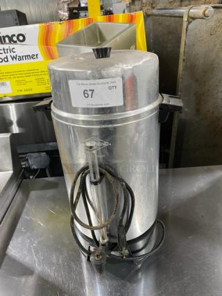 Commercial stainless steel electric coffee urn, insulated, used condition. Features side handles and power cord. Label reads "67 QTY."