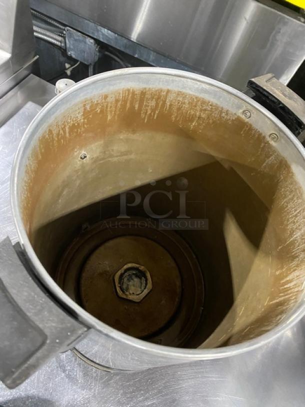 Commercial stainless steel insulated electric coffee urn, interior view. Shows wear, suitable for high-volume use.