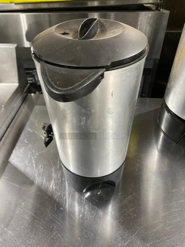 Commercial stainless steel electric coffee urn, insulated, used condition with minor surface scratches, black lid and spout.