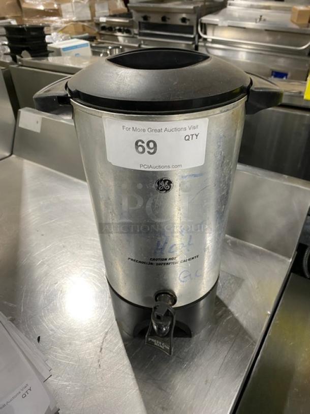 Commercial stainless steel electric coffee urn, insulated, model 936. Visible label with auction number 69. Appears in good condition.