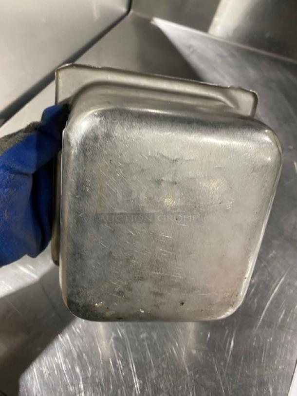 Commercial stainless steel hotel/steamtable pan, well-used condition, showing wear. Durable for catering and food service.