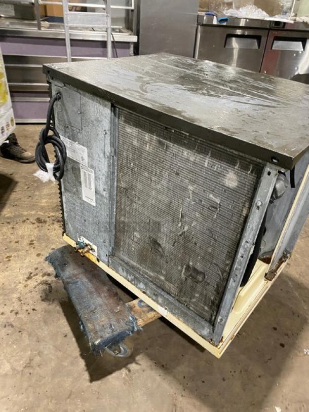 Manitowoc SY0854A ice machine head, stainless steel, electric, air-cooled, model SY0854A, 208-230V, visible wear.