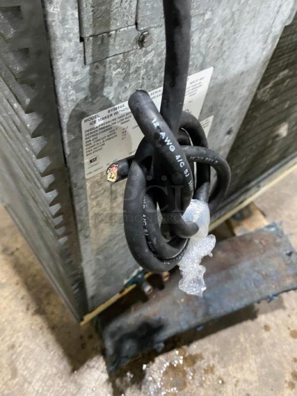 Manitowoc SY0854A commercial ice machine head, stainless steel, electric, air-cooled, 208-230V, 1 Phase, tags visible.