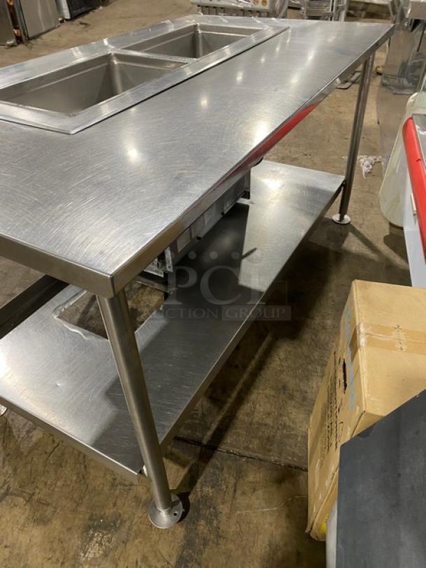 Delfield stainless steel 2-well refrigerated food table, model 8148EFNP. Features single undershelf, electric, on legs.
