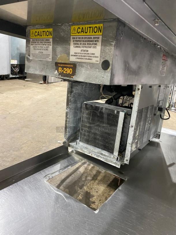 Delfield commercial stainless steel 2-well refrigerated food table, model 8148EFNP. Includes warnings, operates on 115V, 1 phase.
