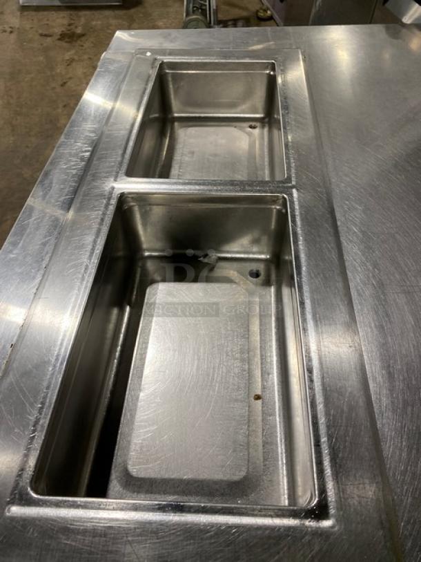 Delfield 8148EFNP stainless steel 2-well refrigerated drop-in food table, electric, single undershelf, on legs.