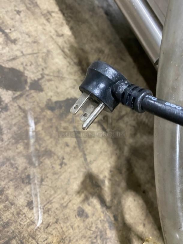 Close-up of a power plug for a Delfield commercial refrigerated drop-in cold food table, model 8148EFNP.