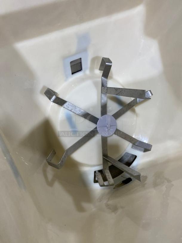 Interior view of Cornelius ED250BCZ beverage dispenser, showing stainless steel mechanical components inside the unit.