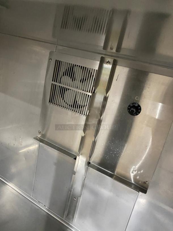 Duke RUF48M stainless steel refrigerated worktop interior, featuring ventilation fan and thermostat. Energy Star certified.