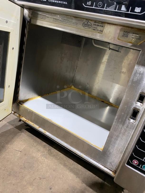 Amana 2014 stainless steel commercial microwave, model RC30S2, with programmable touchpad. Interior shows signs of use.