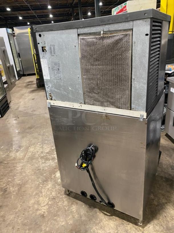 Manitowoc Q Series QD0452A stainless steel ice machine head. 115V, 1 phase. Includes Subway-style dispenser with drip tray. On legs.
