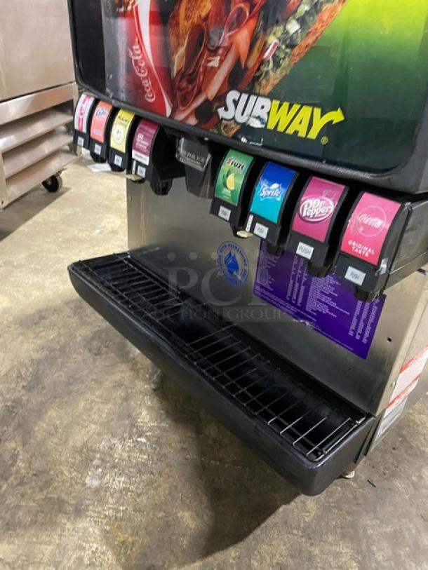 Manitowoc QD0452A stainless steel ice machine with 8-flavor Subway beverage dispenser, drip tray, and legs.