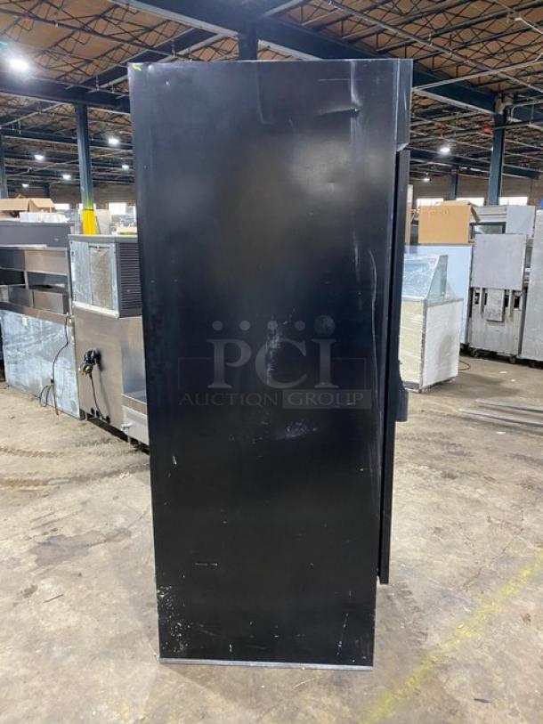 Beverage-Air MT27 commercial refrigerator, black, single glass swing door, poly-coated wire rack, 115V, used condition.