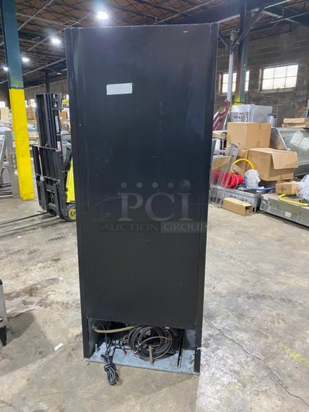 Beverage-Air MT27 commercial refrigerator, black finish, single glass swing door, poly-coated rack, model SN: 6458494, 115V.