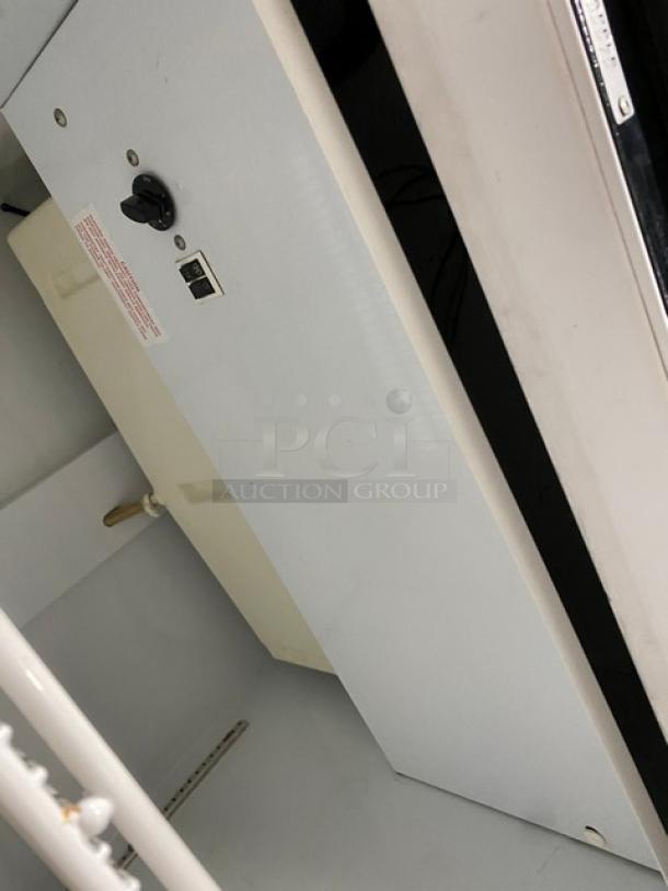 Beverage-Air MT27 merchandiser refrigerator, black, single glass swing door, poly coated wired rack, 115V, used.