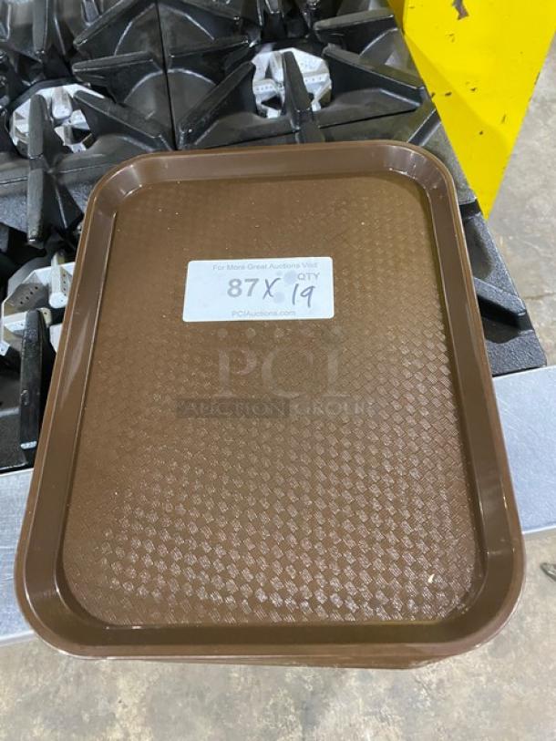 Cambro 1418FF167 commercial brown rectangular fast food tray, textured surface, 19 units available, auction label visible.