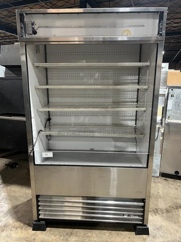 True TAC-48-LD refrigerated display case, stainless steel, multi-tier, with adjustable wired racks, on legs, 208-230V.