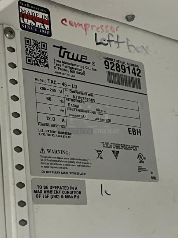 True TAC-48-LD multi-tier refrigerated merchandiser display, stainless steel, adjustable rack, 208-230V, SN: 9289142, on legs.