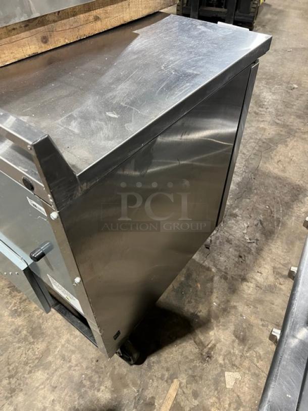 True TWT-48-HC stainless steel 2-door undercounter refrigerator, Energy Star certified, with up-turned backsplash, on casters.