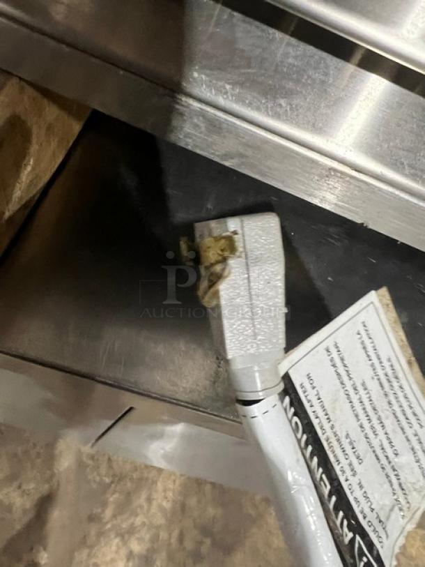 True TWT-48-HC undercounter refrigerator, stainless steel, energy-efficient, upturned backsplash, on casters, model label visible.