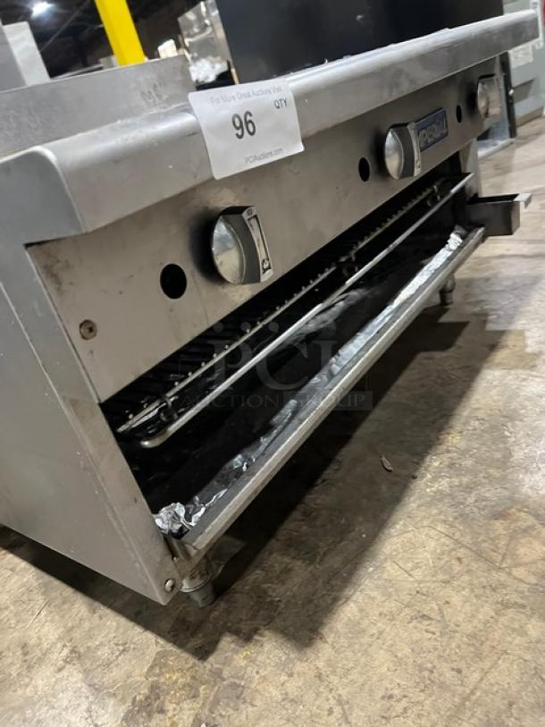 Imperial RG36 stainless steel 36" flat griddle with broiler and cheese melter, on legs, upturned backsplash. Natural gas.