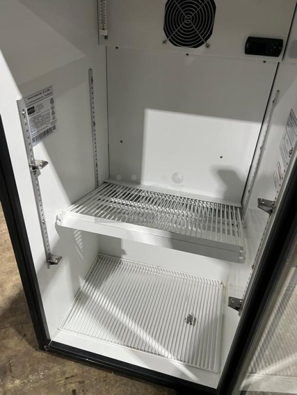 FrigoGlass UR30CC commercial black single glass door beverage merchandiser, 2020 model, with poly coated wire rack, clean interior.