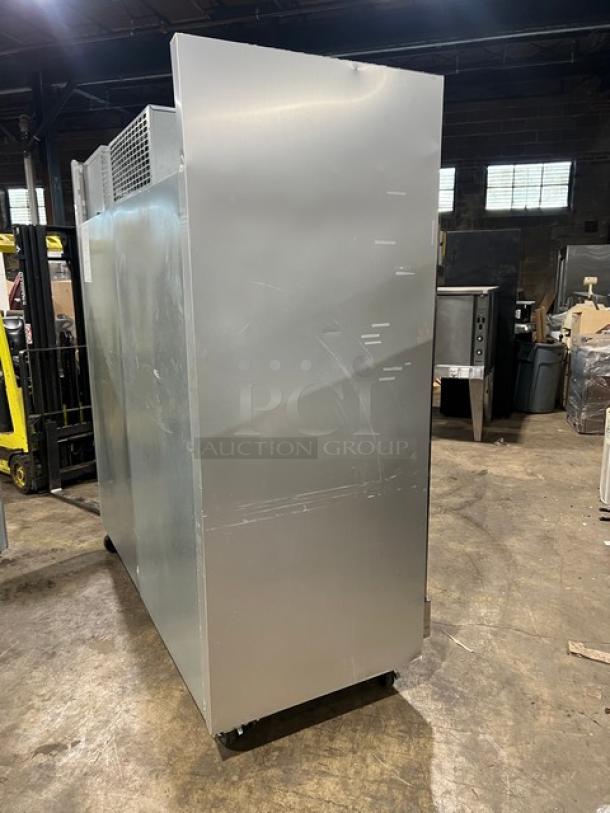 Traulsen G-Series stainless steel triple swing door reach-in freezer, model G31010, on casters, in fair condition.