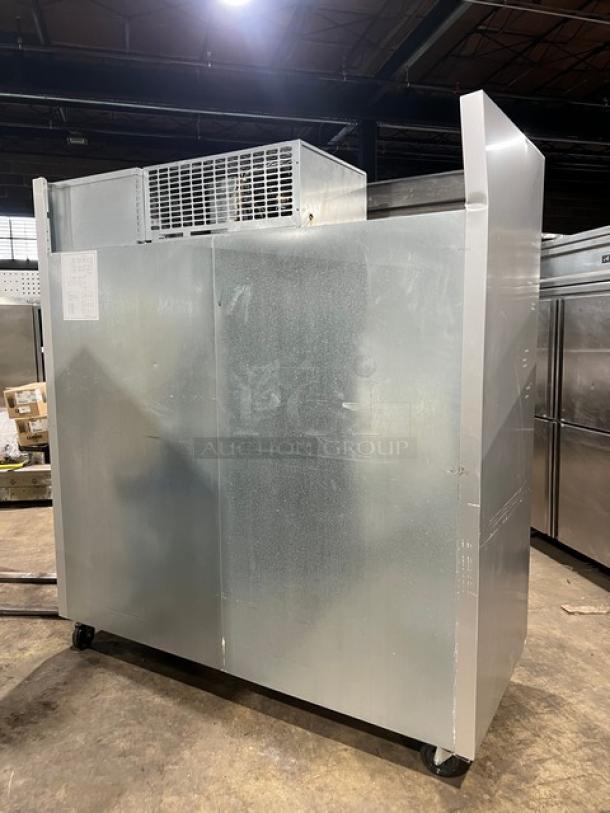 Traulsen G-Series G31010 commercial stainless steel triple swing door reach-in freezer, with poly coated wired rack, on casters.
