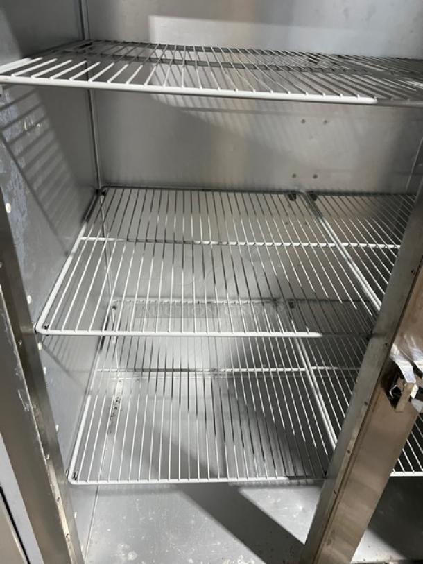Traulsen G-Series Model G31010 stainless steel triple door freezer with poly coated wire racks, on casters, 115V.