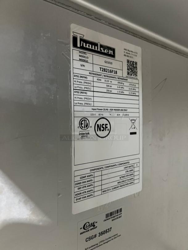 Traulsen G31010 commercial stainless steel freezer label, showing model, SN T28216F18, ETL and NSF certifications.