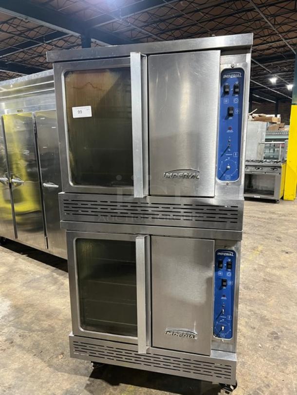 Imperial double-stacked stainless steel convection oven, natural gas-powered, with wired oven rack, on casters.
