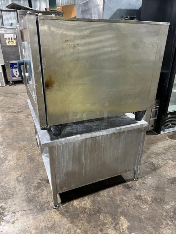 Rational SCCWE62G Self Cooking Center combi oven, 6-pan capacity, stainless steel, natural gas, on stand, fair condition.
