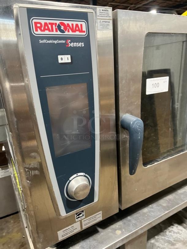 Rational SelfCookingCenter 5Senses SCCWE62G, stainless steel, natural gas, 6-pan capacity, wired racks, 2-section stand, 208V 1 Phase, on legs.