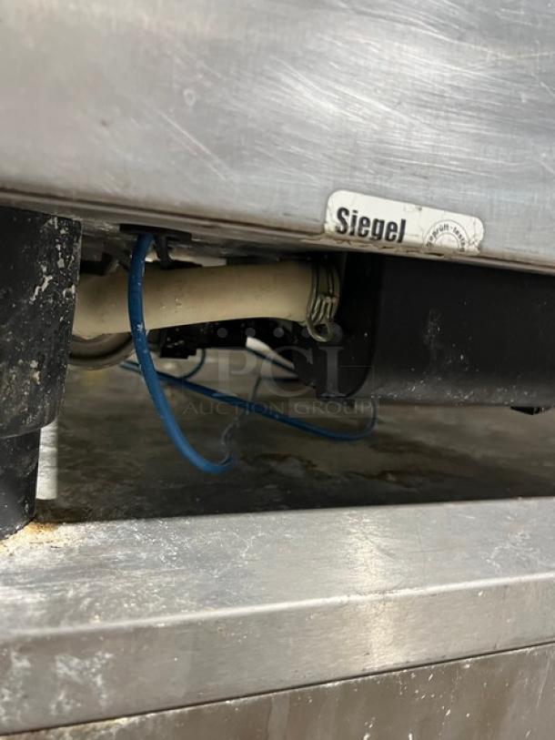 Rational SCCWE62G combi oven, natural gas, stainless steel, 6-pan capacity, on legs, with 2-section pan stand, model label visible.