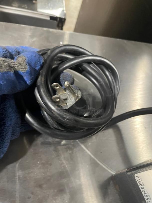 Bunn G1HD Coffee Grinder power cord, black, coiled. Model SN: G100024551 visible. 120V, 1 Phase. Commercial use.