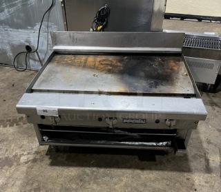 Imperial RG36 stainless steel 36" flat griddle with built-in broiler and upturned backsplash. Natural gas, sturdy legs, used condition.