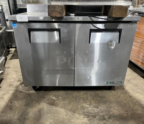 True Commercial TWT-48-HC 2 Door Undercounter Refrigerator, stainless steel, with up-turned backsplash, on casters, very good condition.