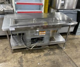 Delfield 8148EFNP stainless steel 2-well refrigerated food table, electric, narrow model, with undershelf, 115V, in good condition.