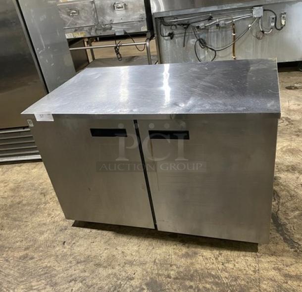 Delfield UC4048P-STAR stainless steel 2-door undercounter refrigerator with coated wired rack, on casters, 115V, 1 phase.