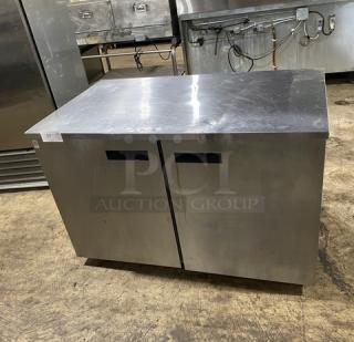 Delfield UC4048P-STAR stainless steel 2-door undercounter refrigerator with coated wired rack, on casters, 115V, 1 phase.