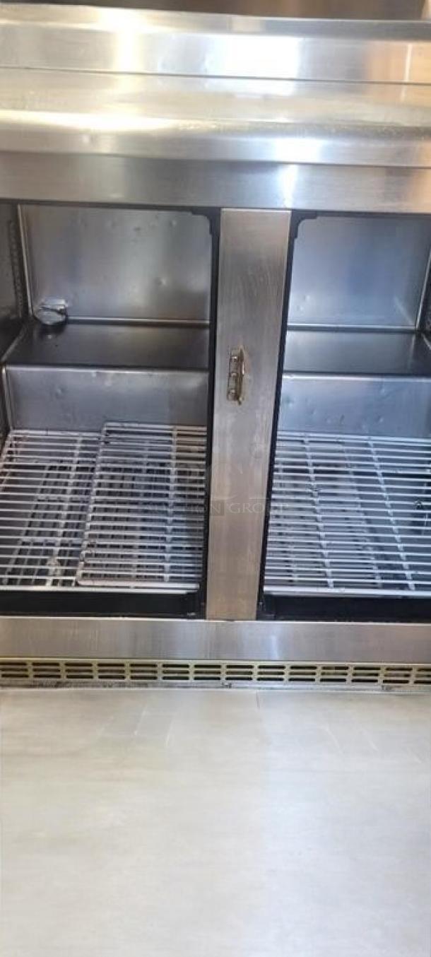 Avantco 178BCB48 two-door glass back bar refrigerator, superb condition, fully tested, 115V, interior shelves visible.