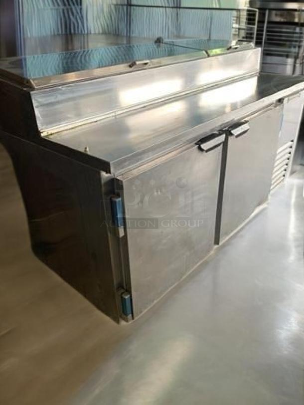 Beverage-Air DP67 pizza prep table, stainless steel, refrigerated base, excellent condition, 67", 115V, tested and working.