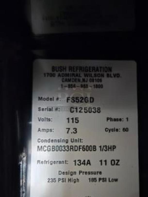 Bush Refrigeration FS52GD display refrigerator label, showing model, voltage, amps, and refrigerant details.